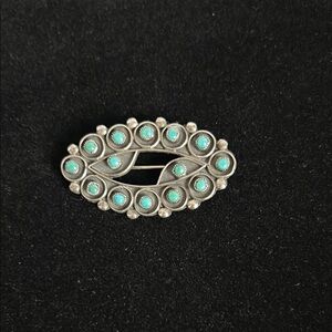 Native American sterling silver/turquoise brooch.